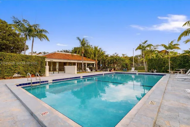 a view of a swimming pool with a chair