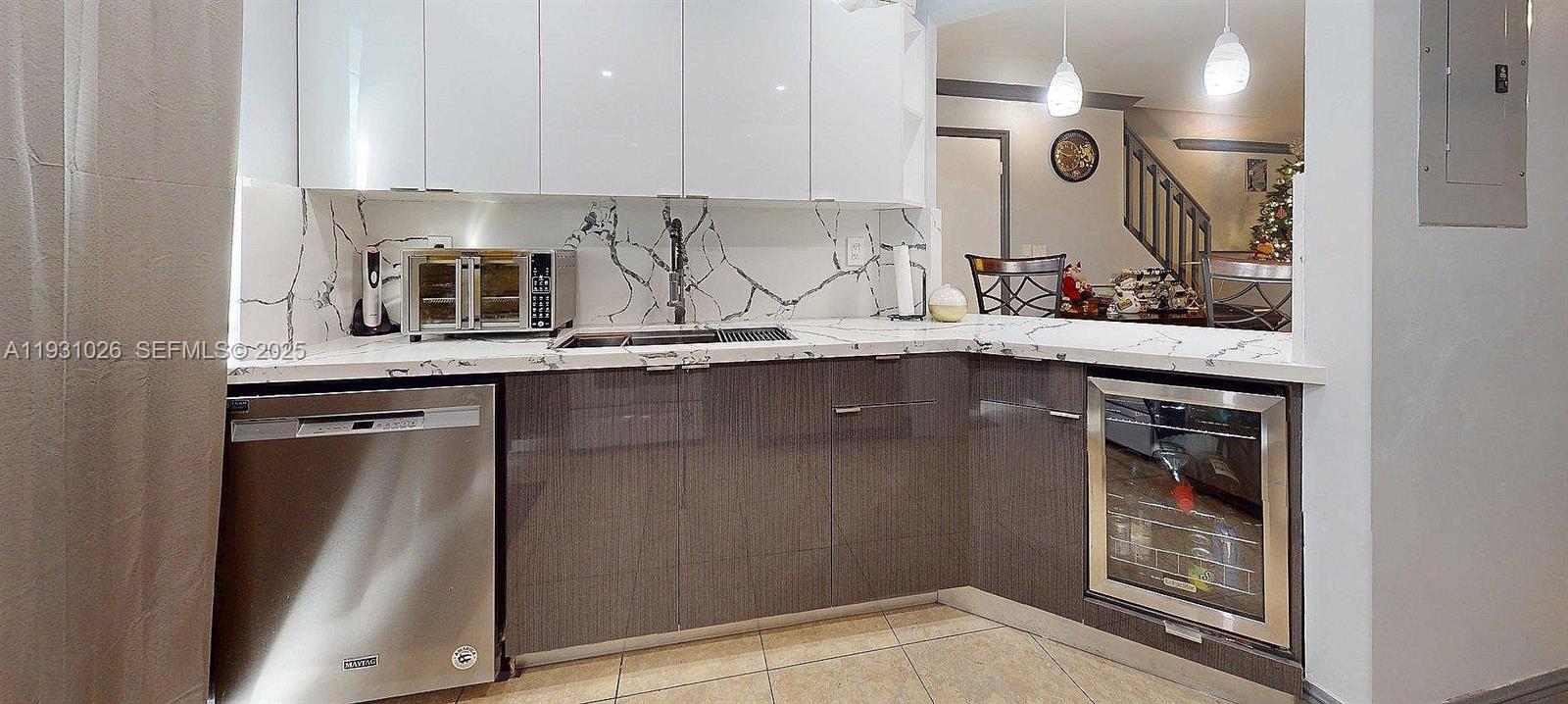 6279 Southwest 128th Court Miami, FL 33183 - Photo 6 of 32 a kitchen with stainless steel appliances granite countertop a sink and cabinets