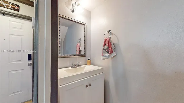 a white toilet sitting next to a bathroom sink