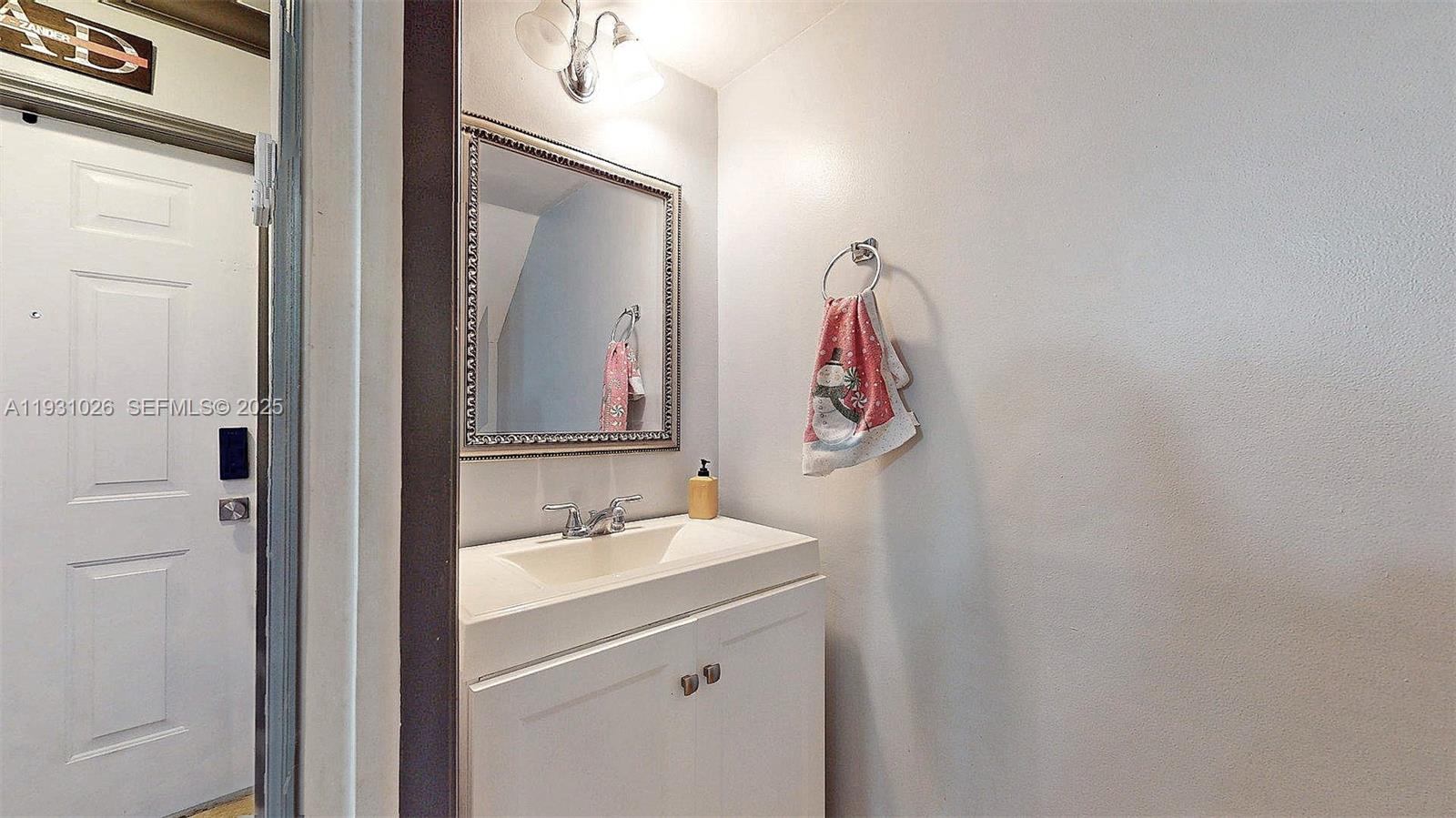 6279 Southwest 128th Court Miami, FL 33183 - Photo 8 of 32 a bathroom with a sink vanity and a mirror