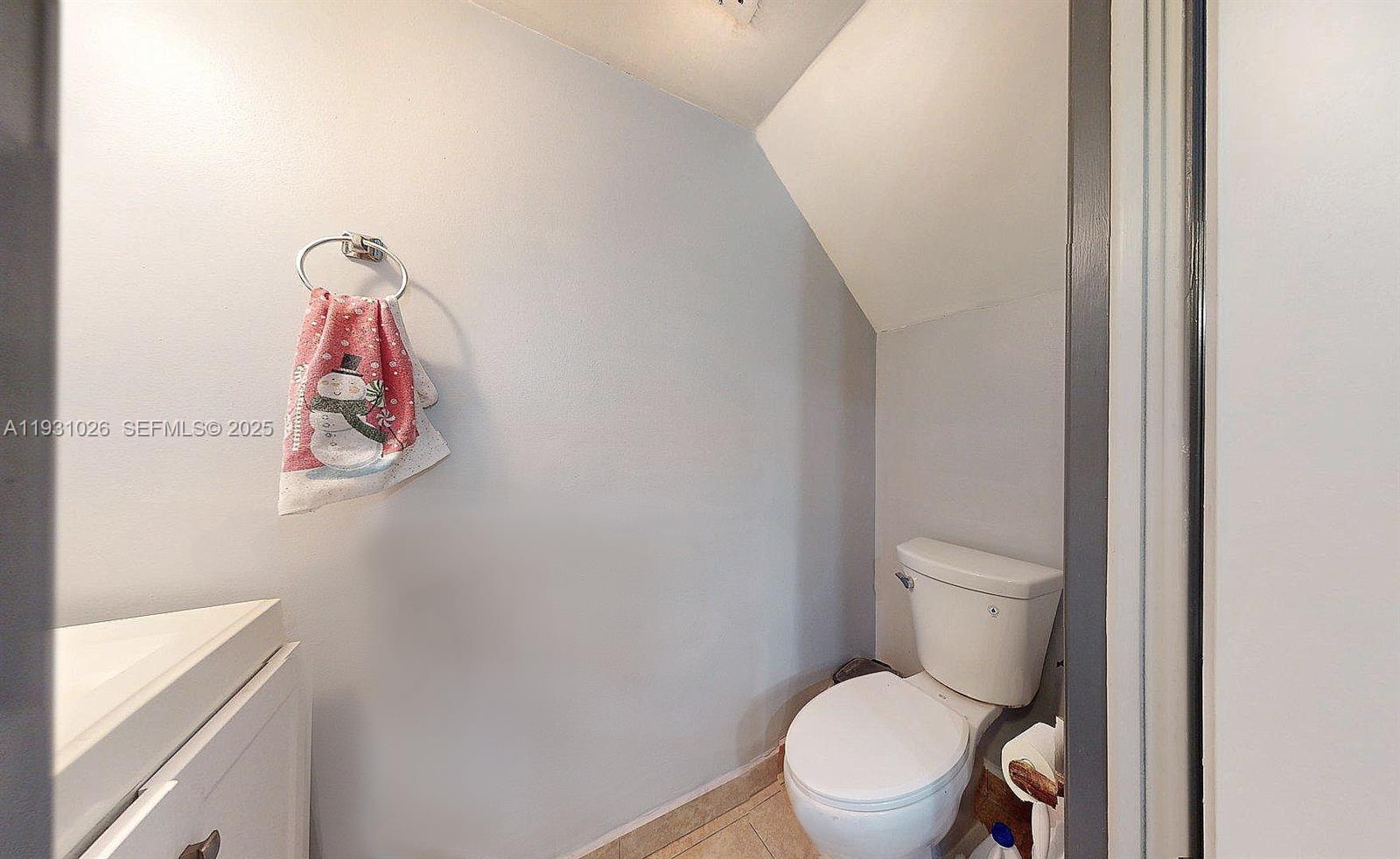 6279 Southwest 128th Court Miami, FL 33183 - Photo 9 of 32 a white toilet sitting next to a bathroom sink