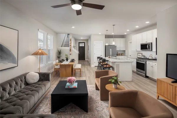 a kitchen with granite countertop stainless steel appliances sink a microwave and cabinets