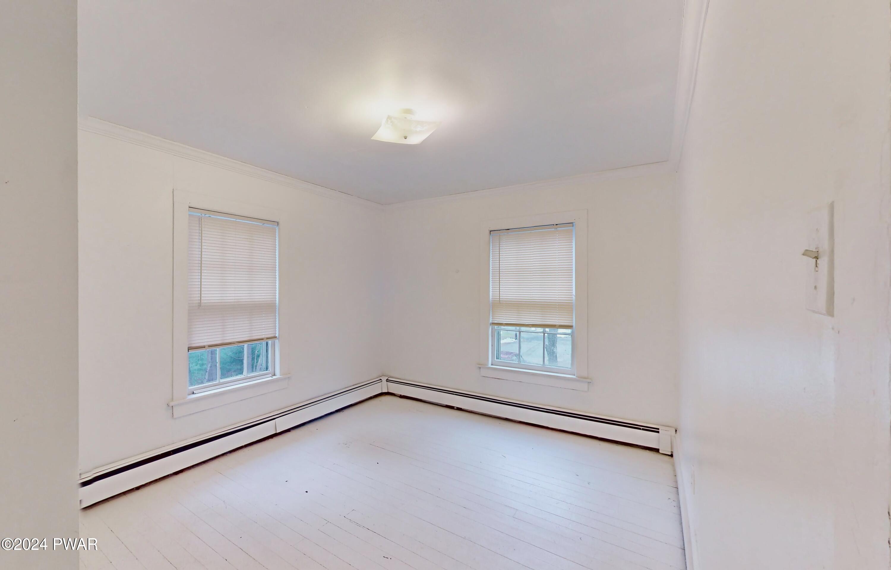 108 9th Street Milford, PA 18337 - Photo 18 of 38 an empty room with windows and closet