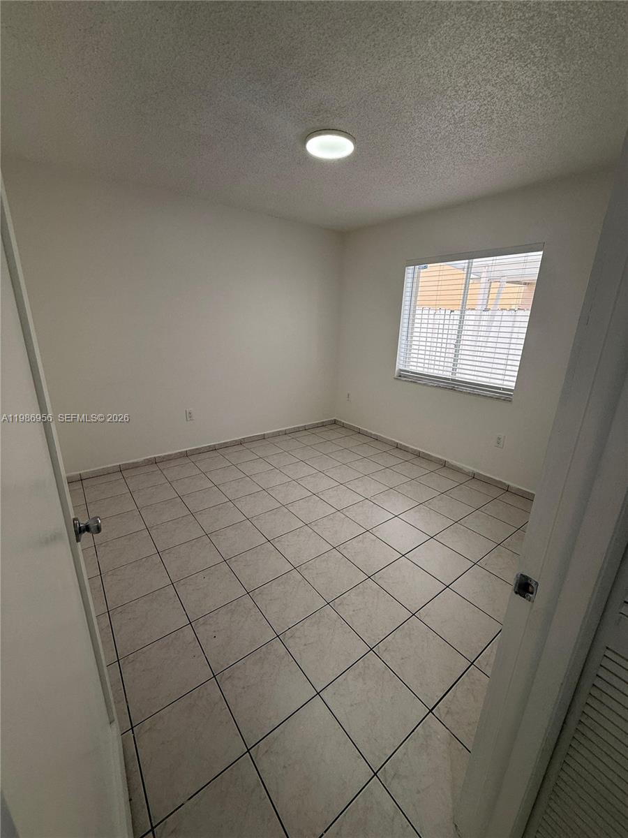 3262 West 70th Street, Unit 101 Hialeah, FL 33018 - Photo 15 of 17 Second Bedroom