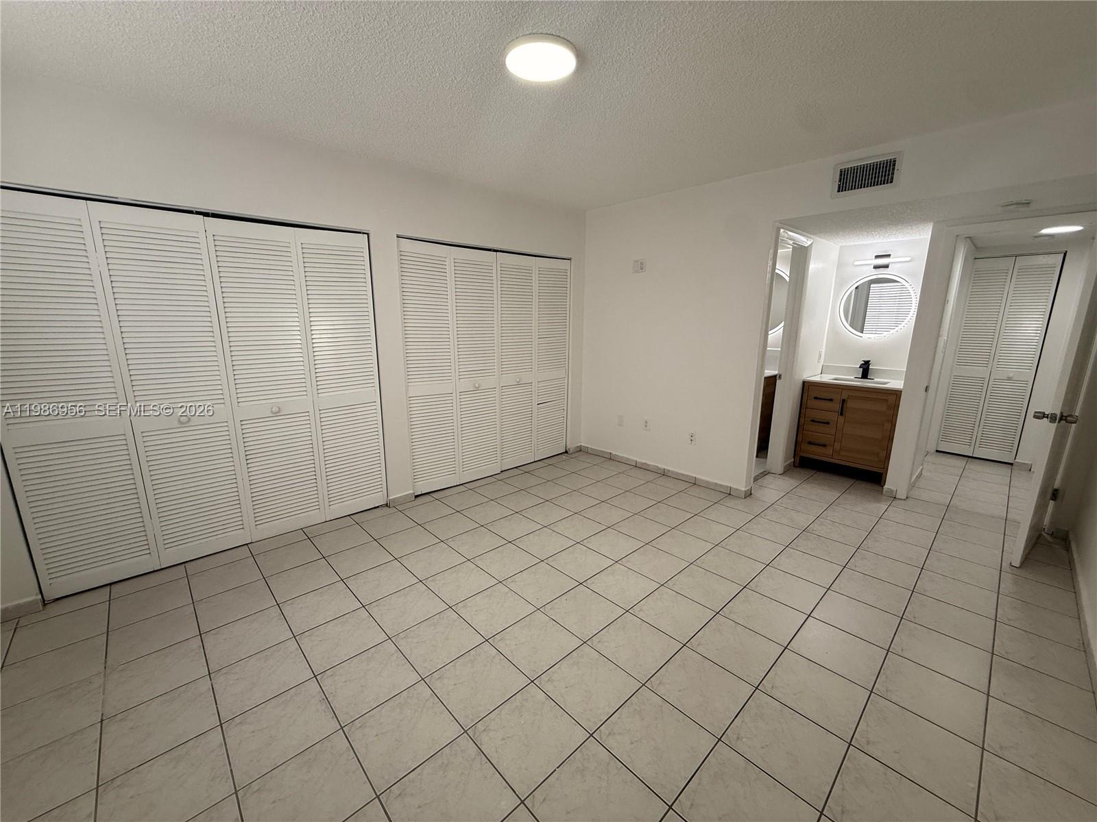 3262 West 70th Street, Unit 101 Hialeah, FL 33018 - Photo 10 of 17 Master Bedroom