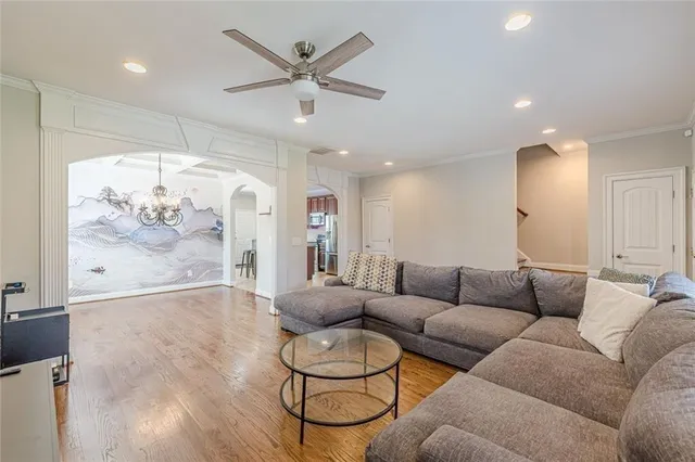 a kitchen with stainless steel appliances granite countertop wooden cabinets a stove a sink and a refrigerator