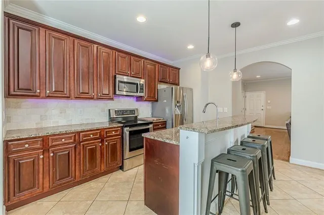 an empty room with closet and a ceiling fan