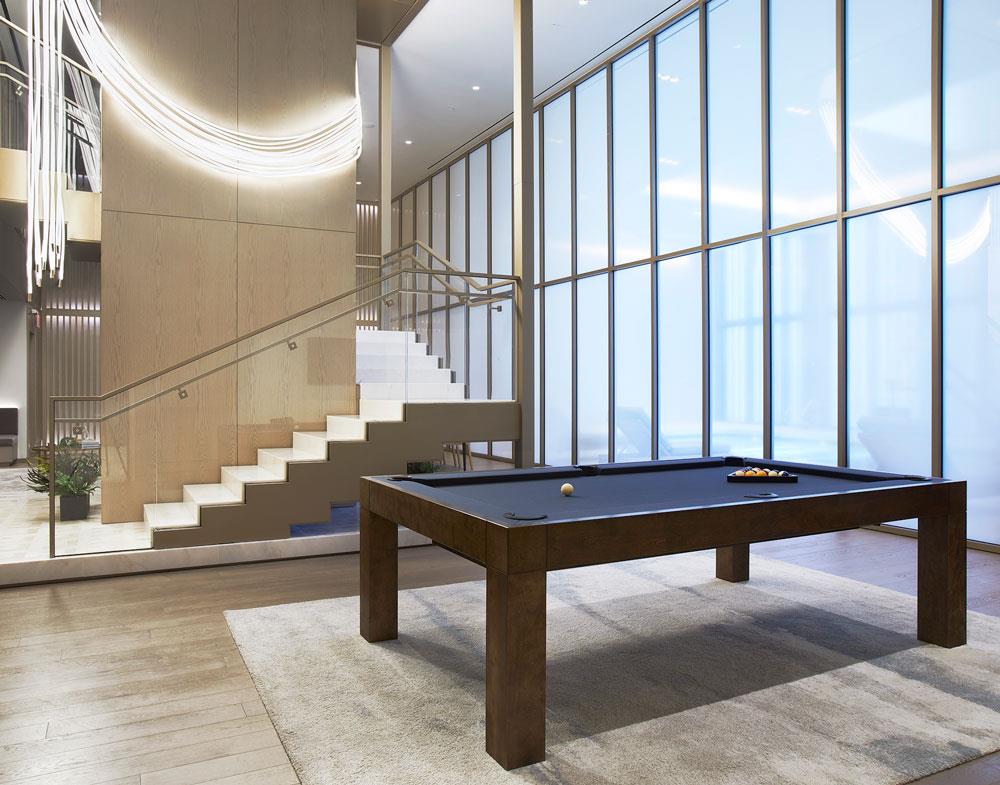 3 Court Square, Unit 2902 Queens, NY 11101 - Photo 10 of 12 a room with lots of furniture and windows