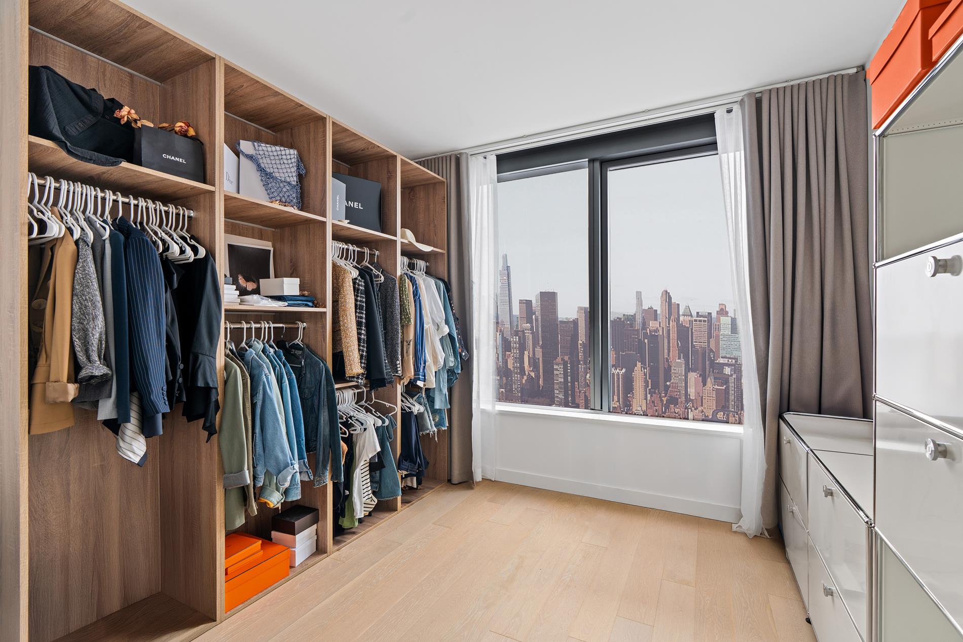 3 Court Square, Unit 2902 Queens, NY 11101 - Photo 4 of 12 a view of walk in closet with clothes and shoes