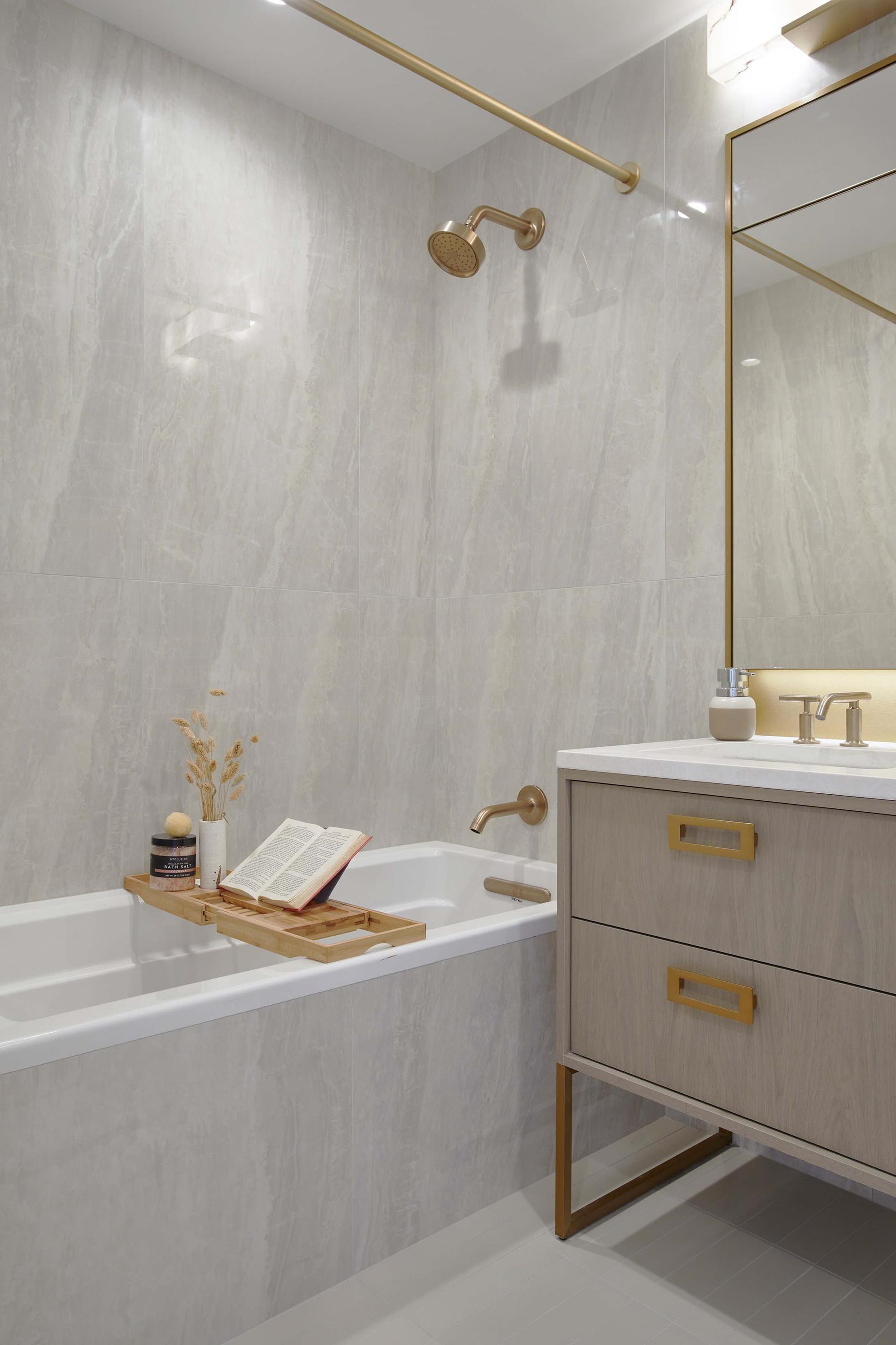 3 Court Square, Unit 2902 Queens, NY 11101 - Photo 6 of 12 a bathroom with a sink and a bathtub