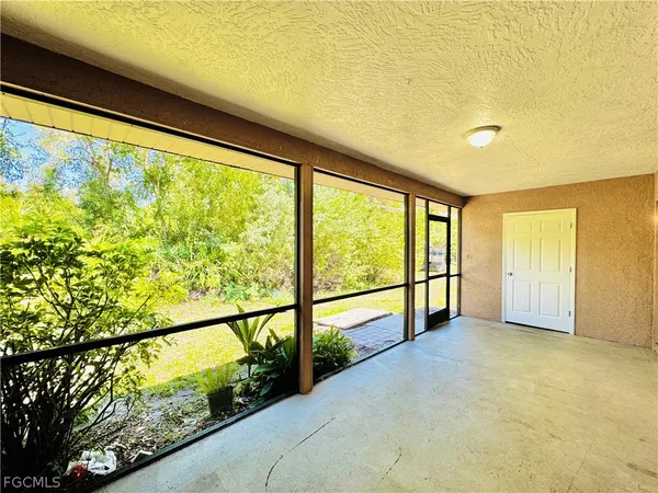 a view of an empty room with a large window