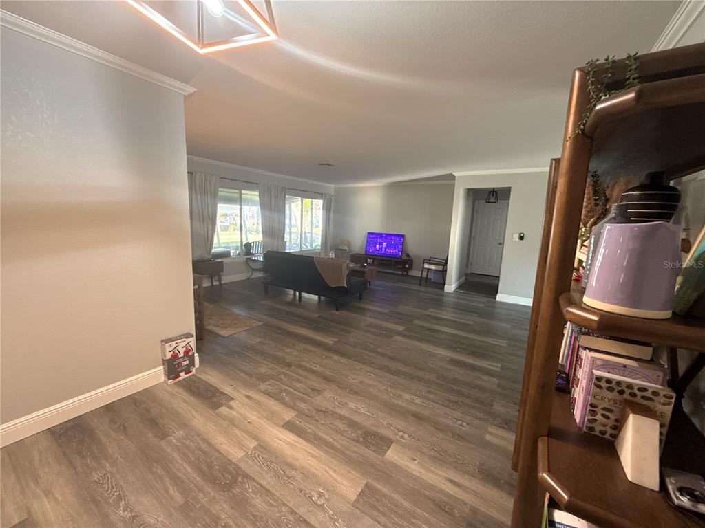903 North Harbor Terrace Road Tavares, FL 32778 - Photo 26 of 69 a view of a room with wooden floor and furniture