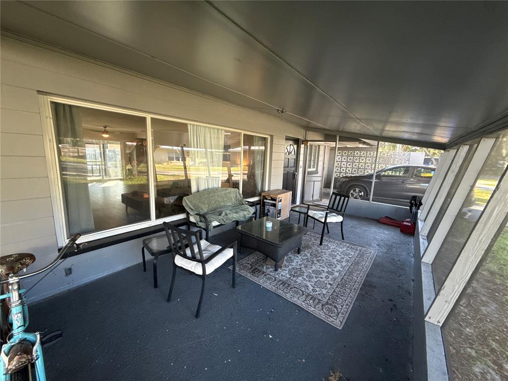 903 North Harbor Terrace Road Tavares, FL 32778 - Photo 6 of 69 a living room with furniture and a large window