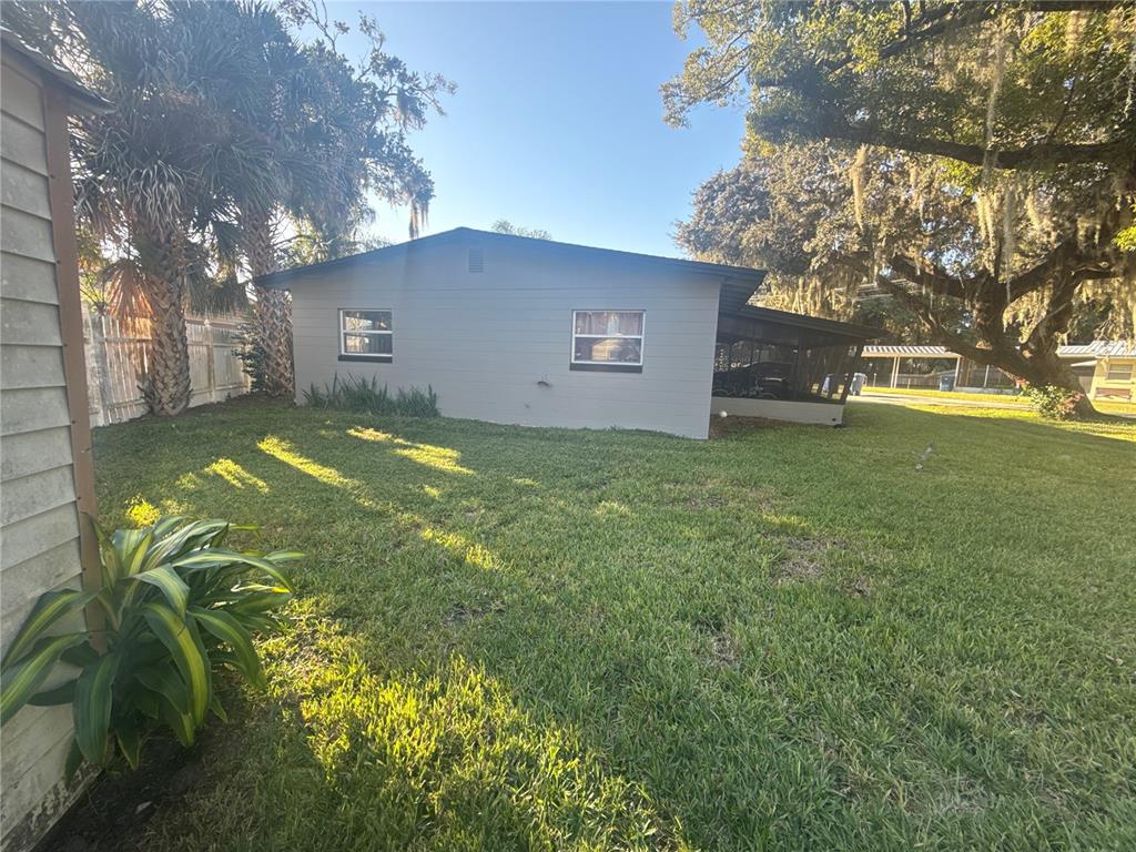 903 North Harbor Terrace Road Tavares, FL 32778 - Photo 65 of 69 a view of a house with a yard