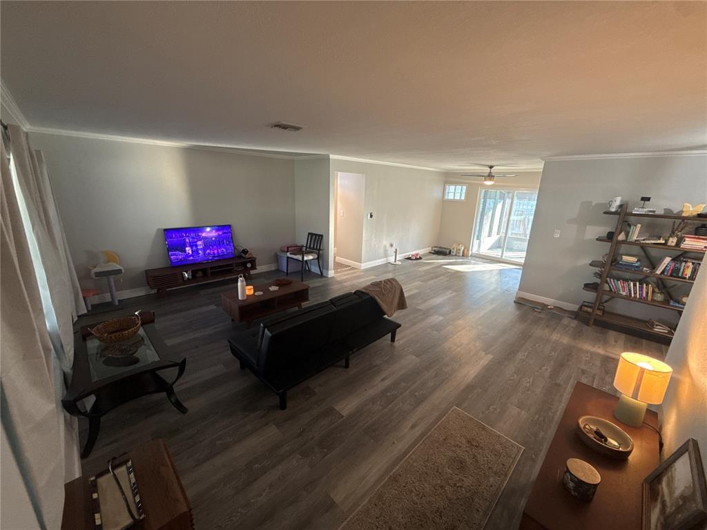 903 North Harbor Terrace Road Tavares, FL 32778 - Photo 8 of 69 a living room with furniture and a flat screen tv