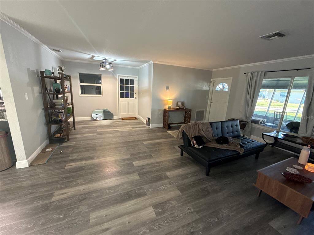 903 North Harbor Terrace Road Tavares, FL 32778 - Photo 10 of 69 a living room with furniture and a wooden floor