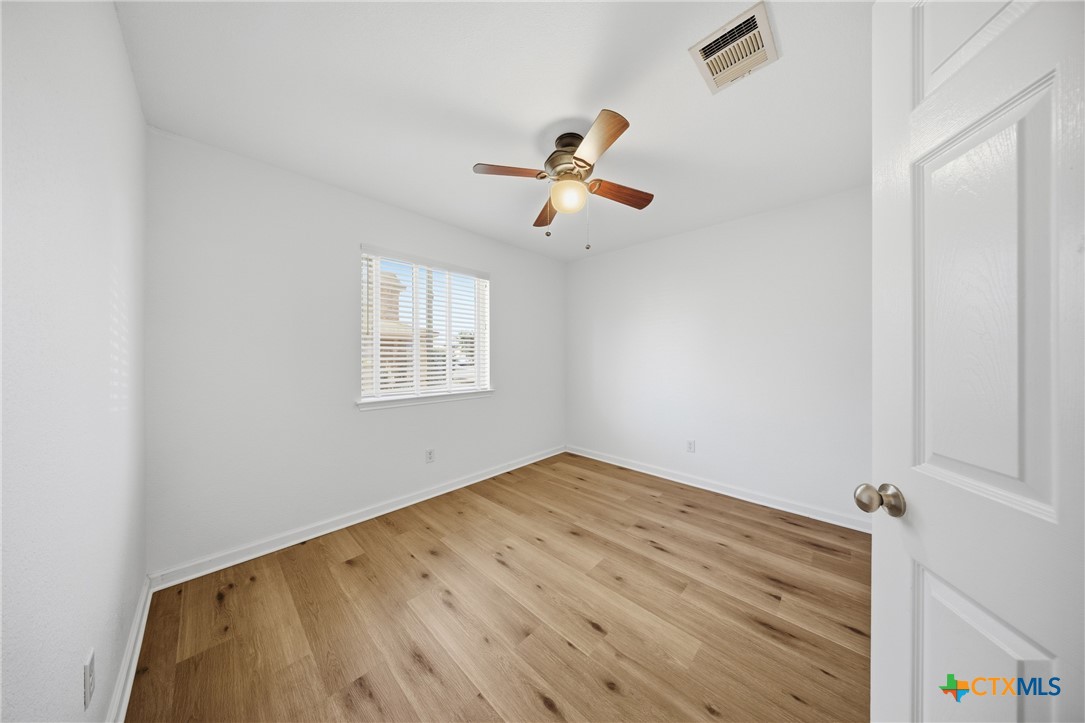 658 Devin Drive Temple, TX 76502 - Photo 23 of 30 an empty room with a window and ceiling fan