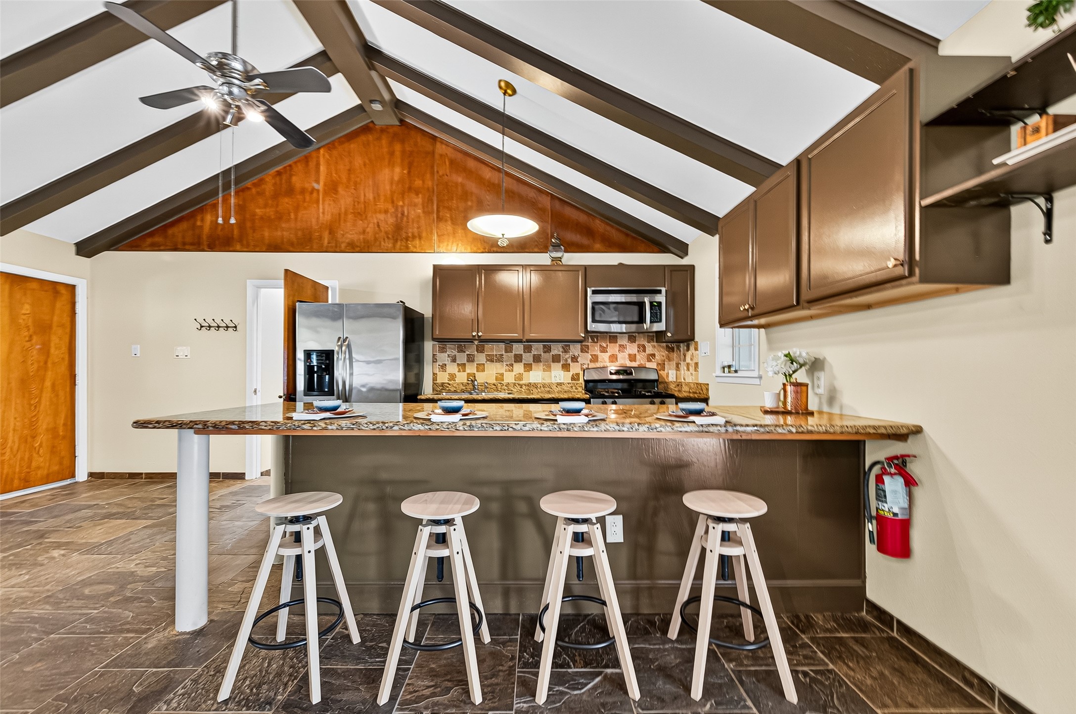 4628 Roseneath Drive, Unit A Houston, TX 77021 - Photo 4 of 21 Long kitchen island with granite countertop that doubles as a breakfast bar.