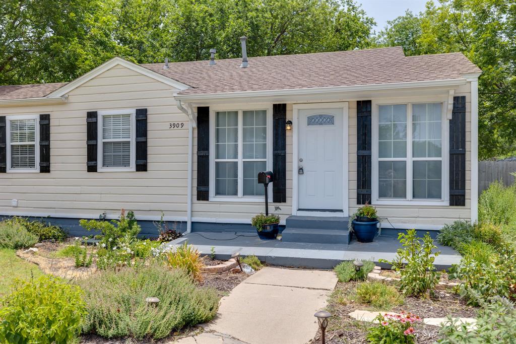 3909 Locke Avenue Fort Worth, TX 76107 - Photo 1 of 1 a front view of a house with garden