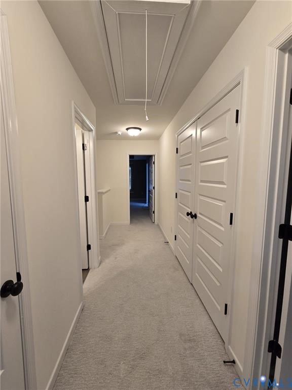 7825 Old Guild Road Richmond, VA 23237 - Photo 15 of 27 Neutral-toned carpeted hallway featuring multiple