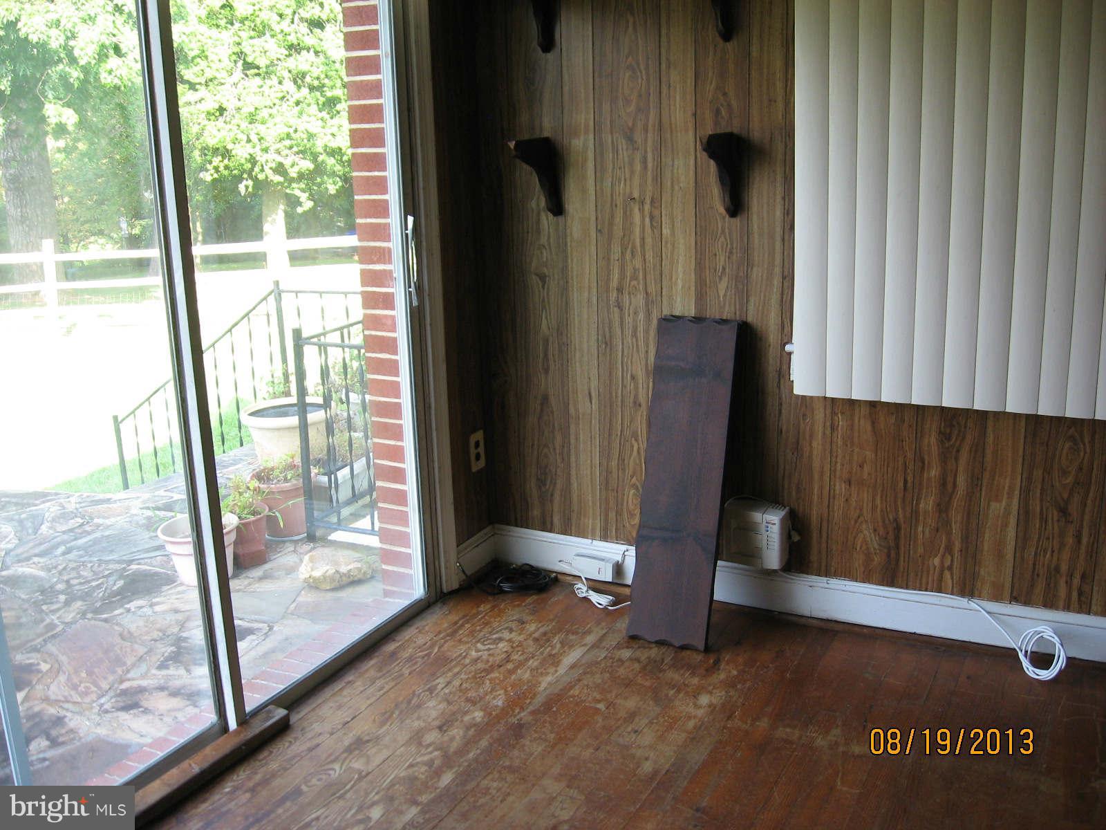 315 Bryants Nursery Road Silver Spring, MD 20905 - Photo 12 of 24 a view of an empty room with floor to ceiling window