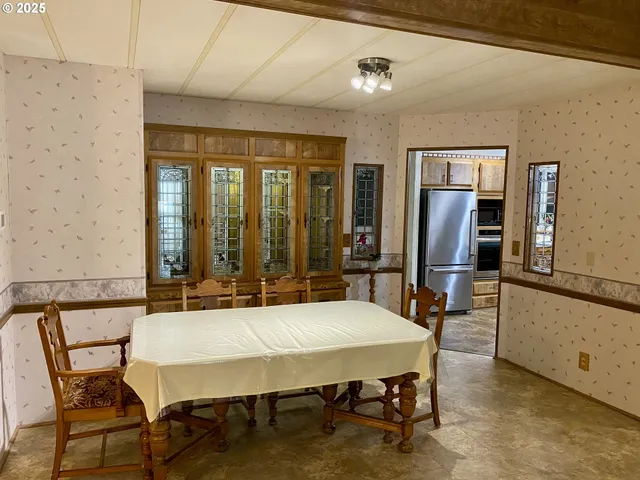 a living room with furniture and a lamp