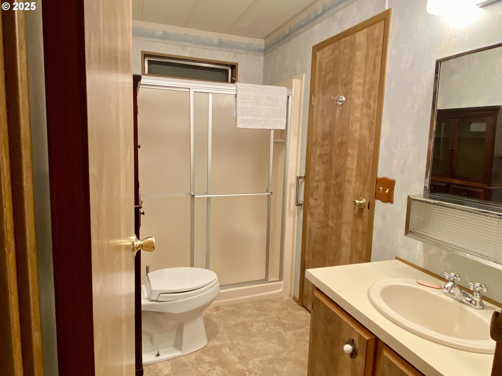 7858 Southeast King Road, Unit 7 Milwaukie, OR 97222 - Photo 24 of 31 a bathroom with a sink toilet and shower