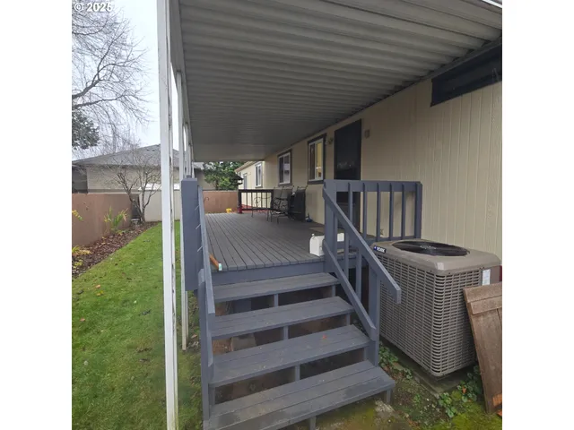 a view of a patio with table and chairs