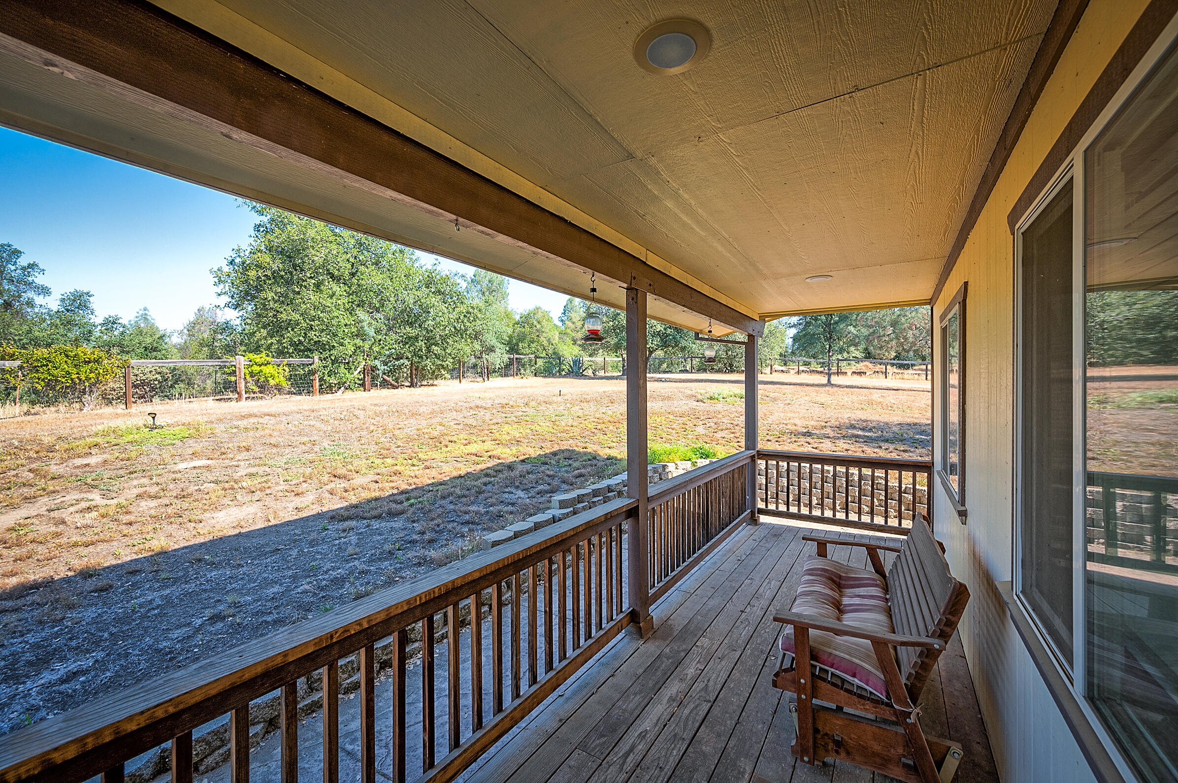 12265 Randolph Road Redding, CA 96003 - Photo 3 of 35 a view of a balcony with wooden floor