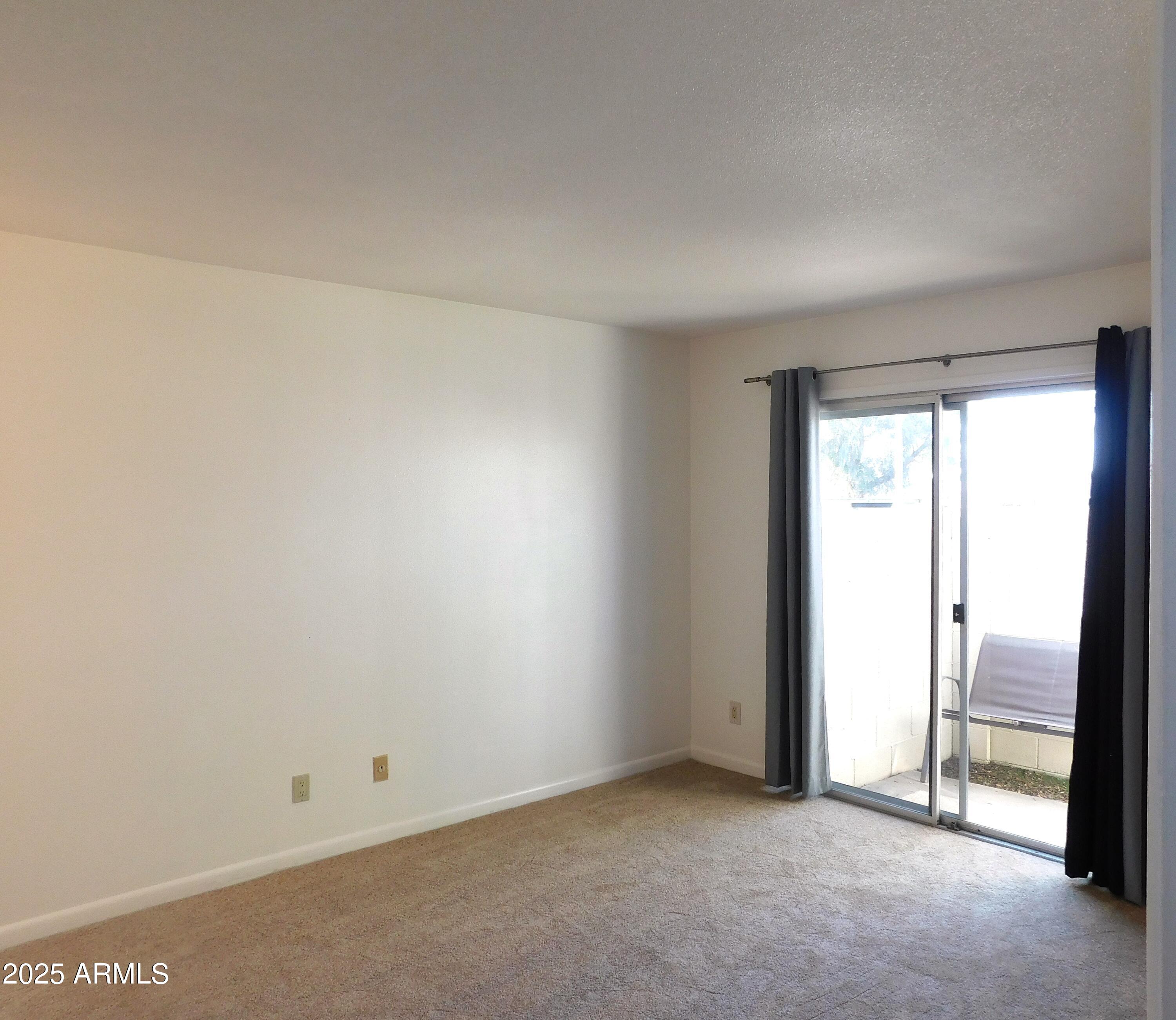 520 South Evergreen Road Tempe, AZ 85288 - Photo 16 of 24 an empty room with sliding door