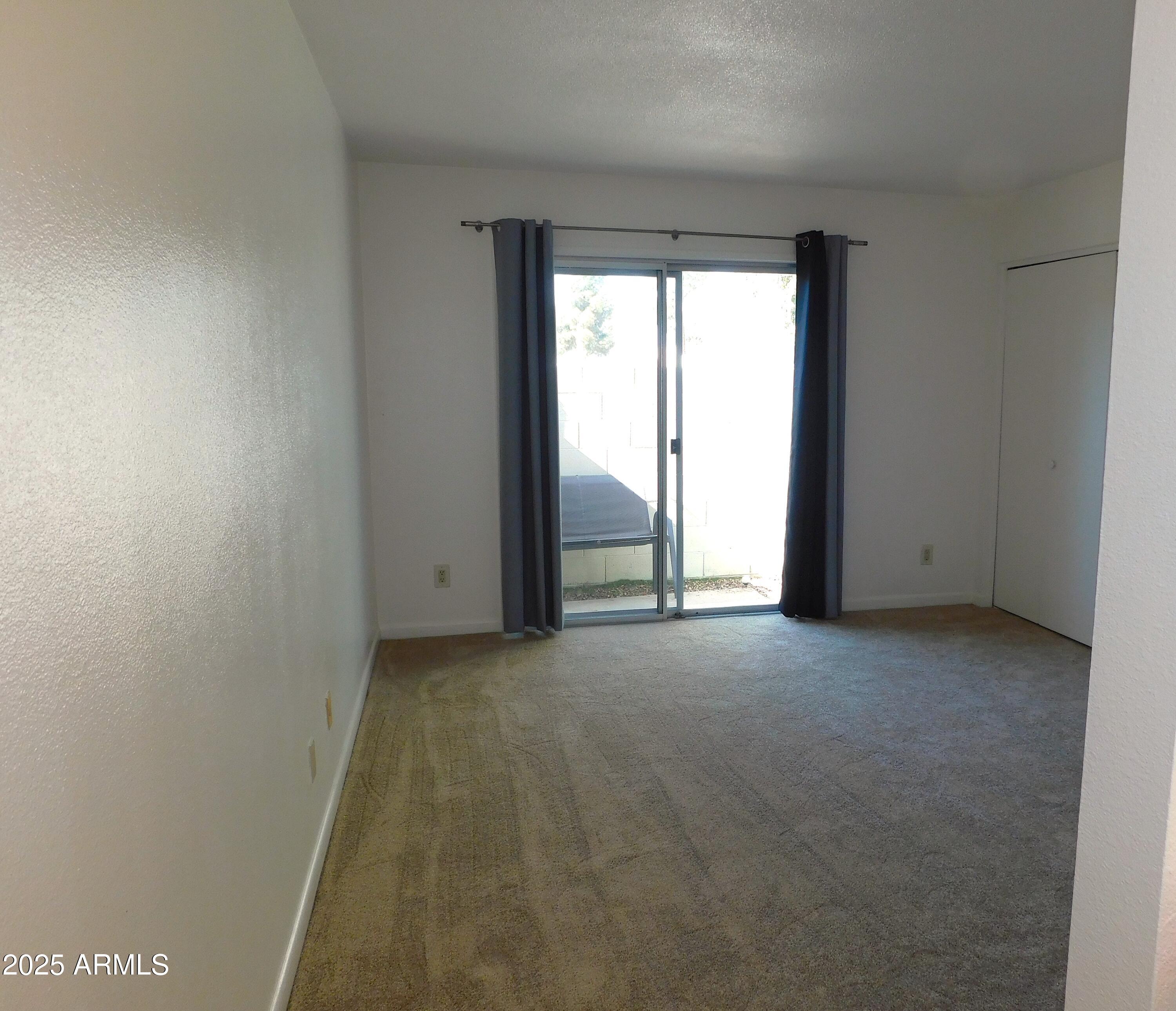 520 South Evergreen Road Tempe, AZ 85288 - Photo 18 of 24 a view of an empty room with a window