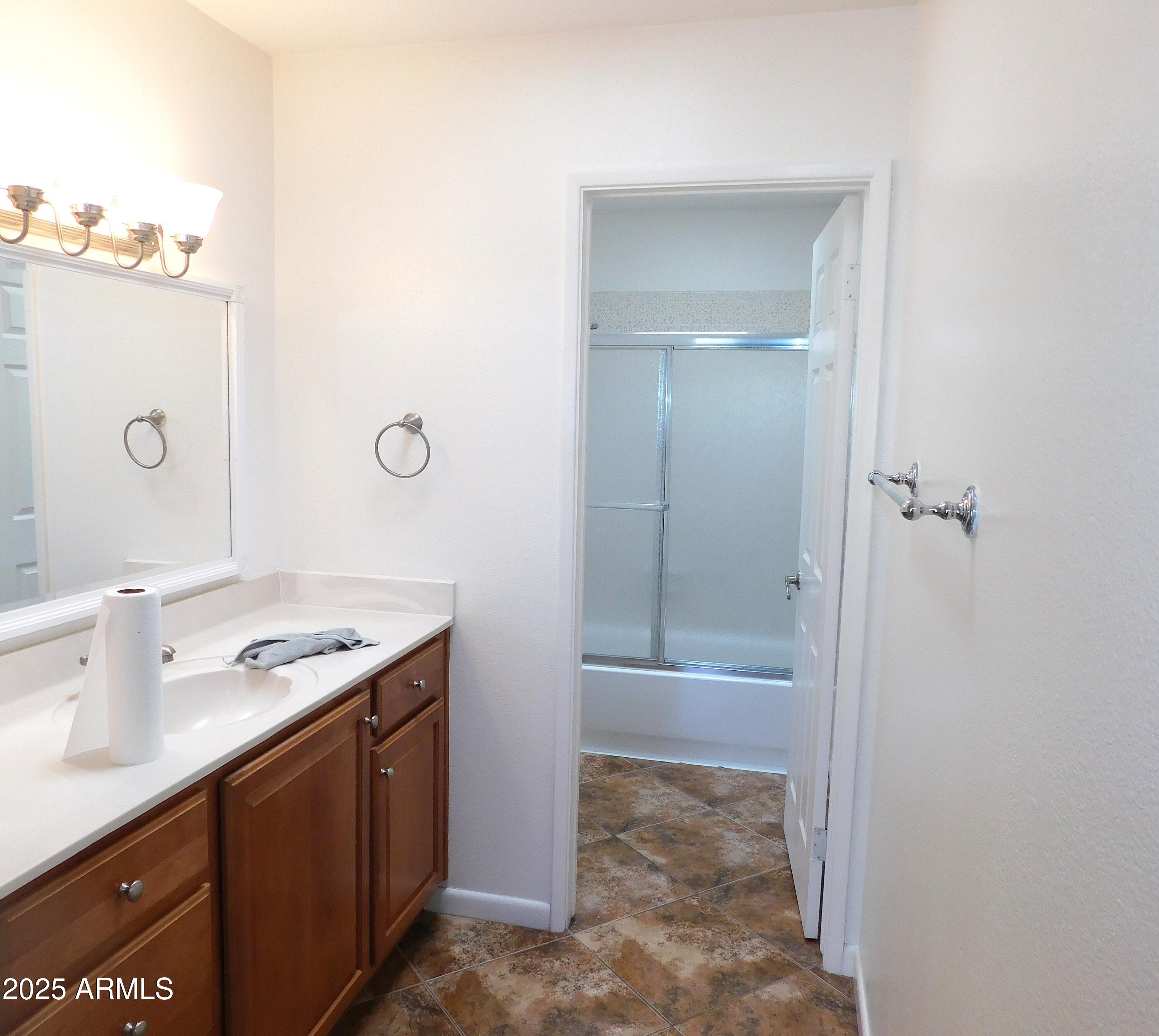 520 South Evergreen Road Tempe, AZ 85288 - Photo 19 of 24 a bathroom with a granite countertop sink a toilet and shower