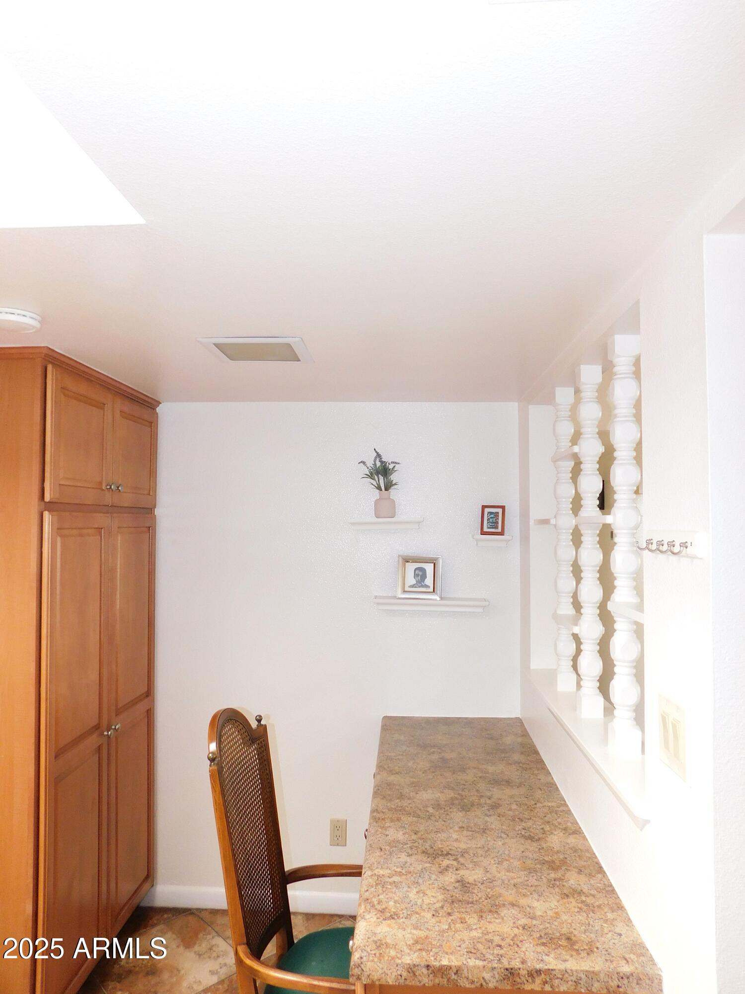 520 South Evergreen Road Tempe, AZ 85288 - Photo 9 of 24 a view of kitchen with refrigerator and chair