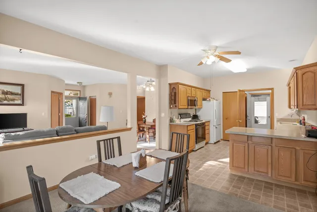 a view of a dining room with furniture and a livingroom