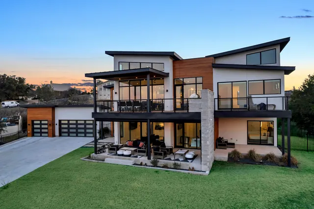 a front view of house with yard and outdoor seating