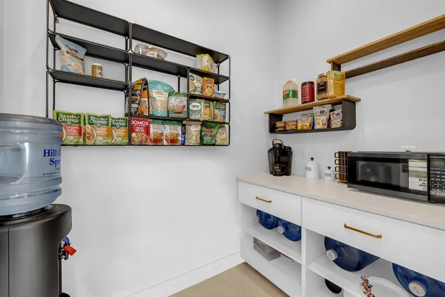 a kitchen with stainless steel appliances cabinets and a counter top space