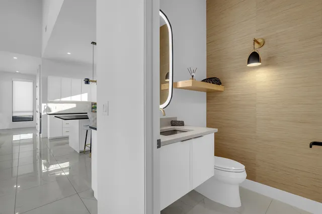 a bathroom with a toilet sink and shower