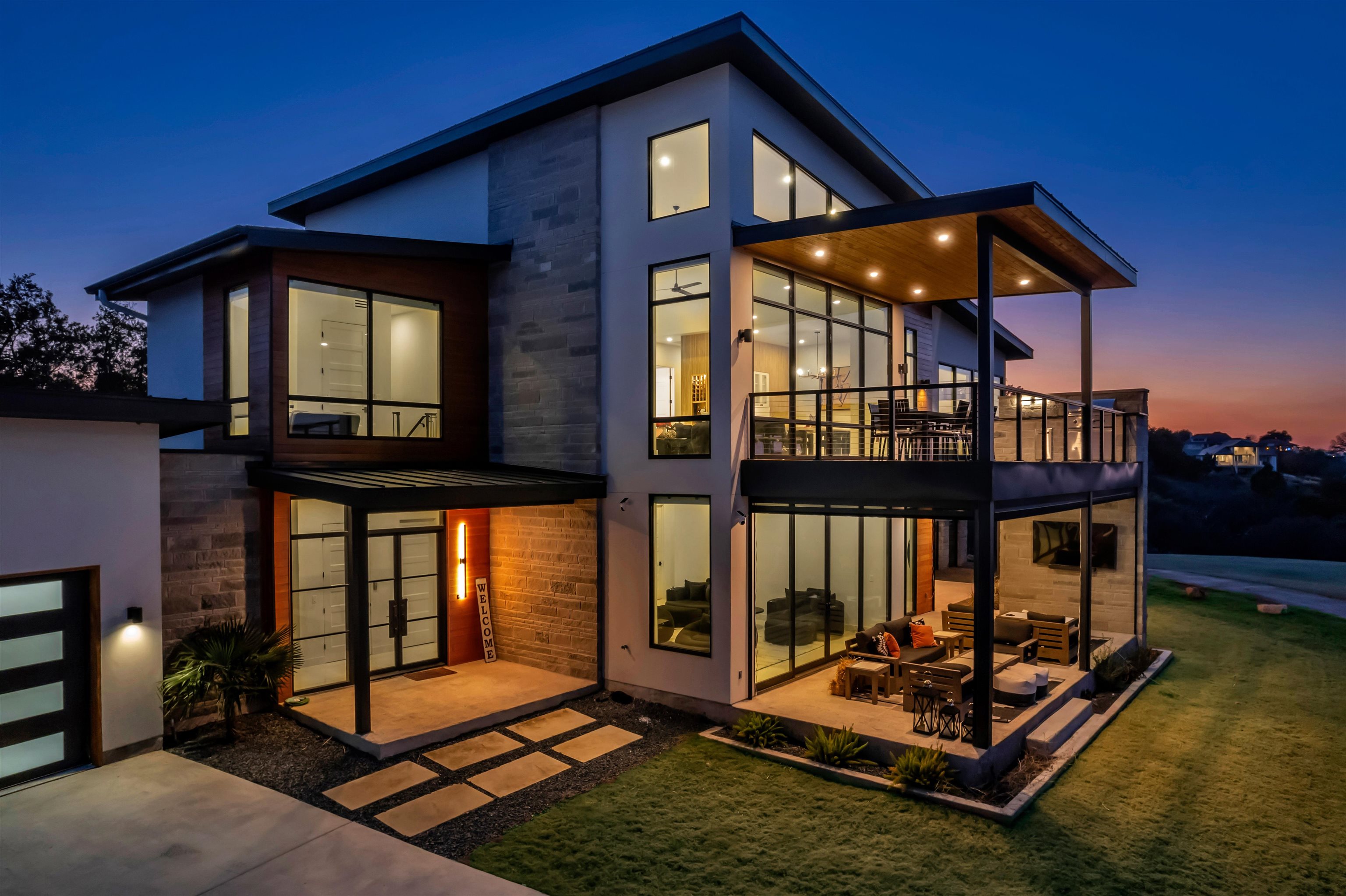 207 Kites Court Horseshoe Bay, TX 78657 - Photo 2 of 30 a table and chairs in front of a house