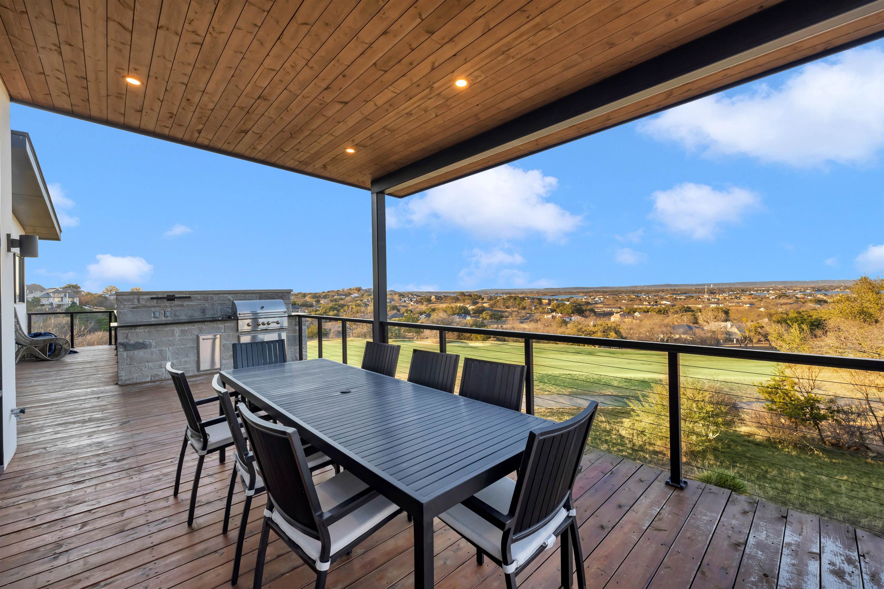 207 Kites Court Horseshoe Bay, TX 78657 - Photo 23 of 30 a view of a dining room with furniture and wooden floor