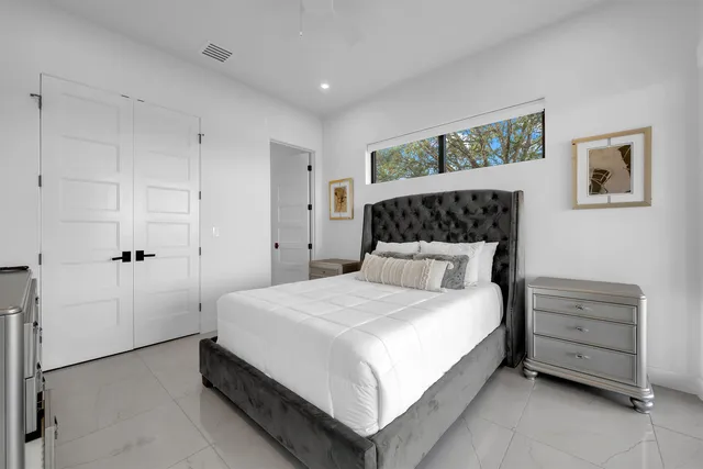 a bedroom with a bed and dresser