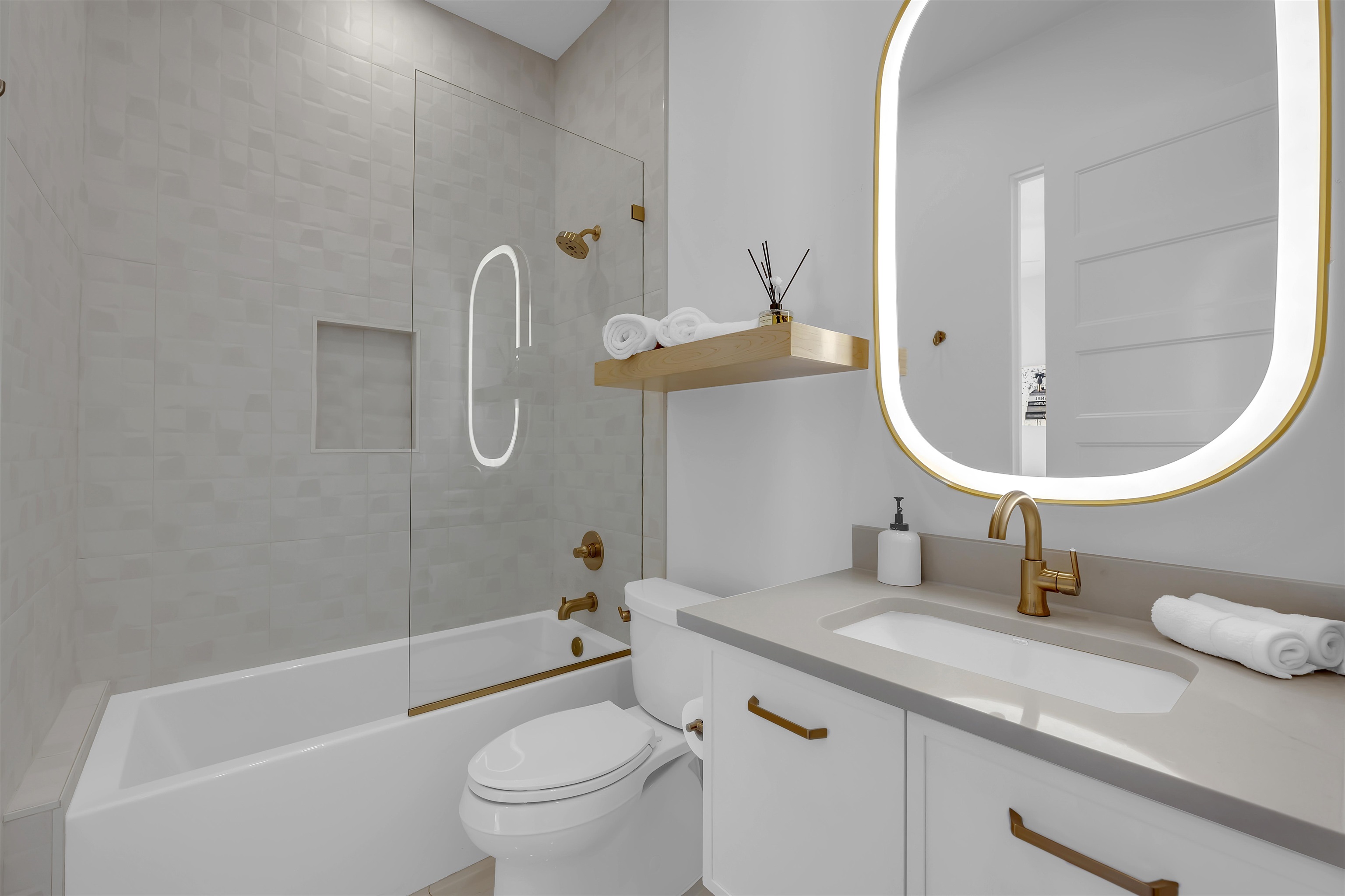 207 Kites Court Horseshoe Bay, TX 78657 - Photo 27 of 30 a bathroom with a sink a toilet and a mirror