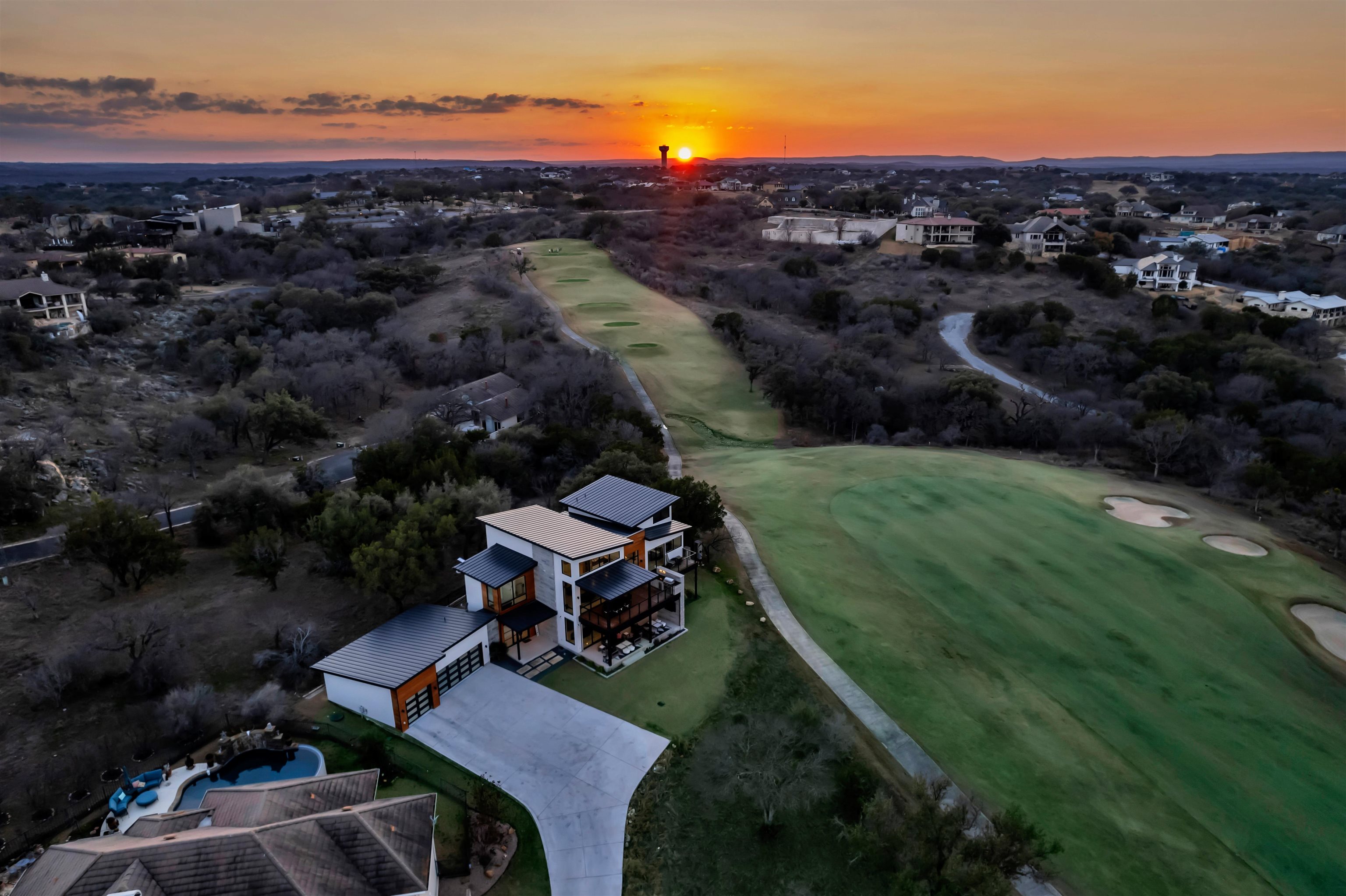 207 Kites Court Horseshoe Bay, TX 78657 - Photo 3 of 30 an aerial view of a house with a garden