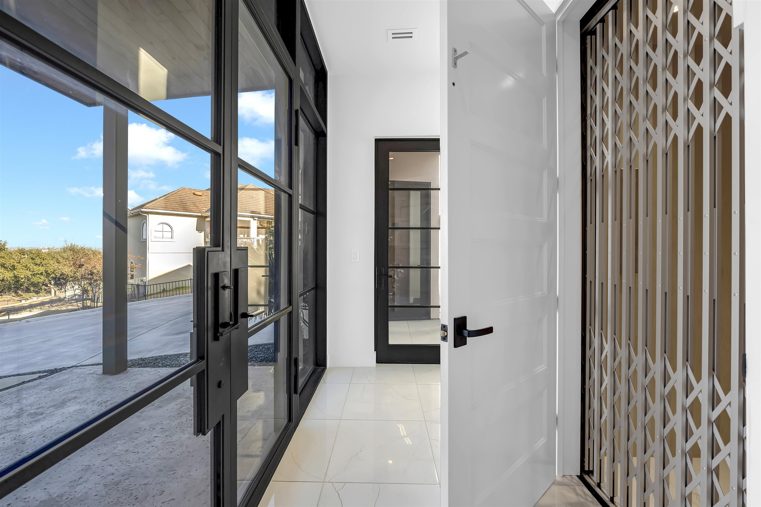 207 Kites Court Horseshoe Bay, TX 78657 - Photo 8 of 30 a view of a bathroom with a glass door