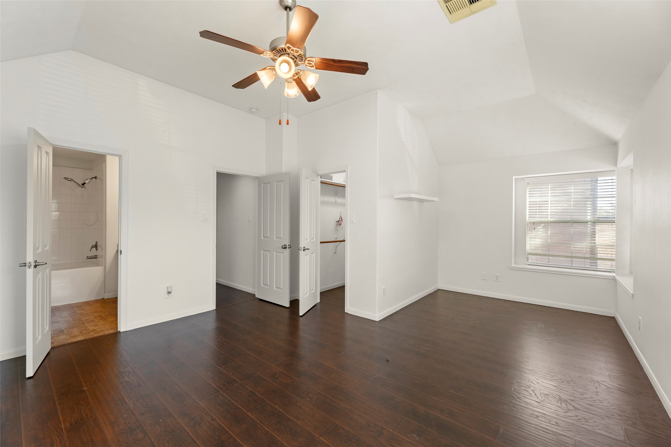 3406 Inverness Path Lane Houston, TX 77053 - Photo 22 of 34 an empty room with wooden floor fan and windows
