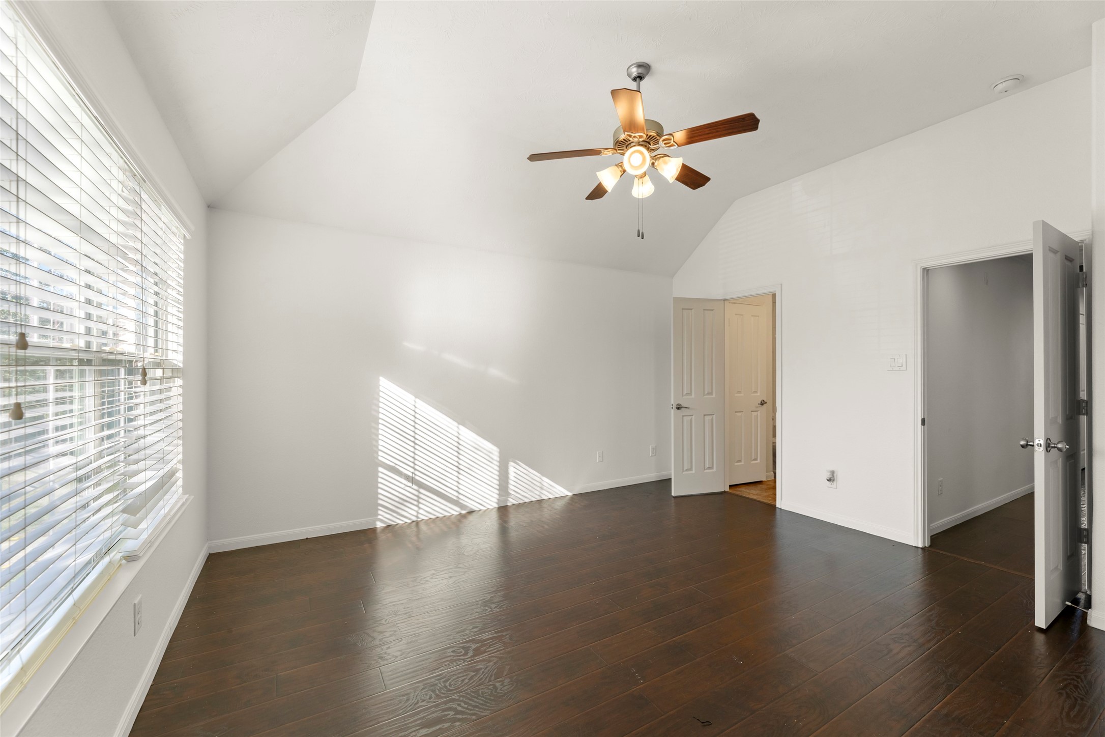 3406 Inverness Path Lane Houston, TX 77053 - Photo 26 of 34 an empty room with wooden floor fan and windows