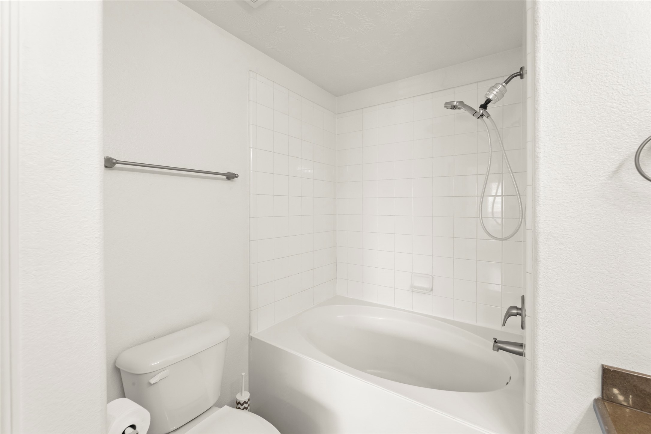 3406 Inverness Path Lane Houston, TX 77053 - Photo 27 of 34 a white bath tub sitting next to a white toilet and a shower