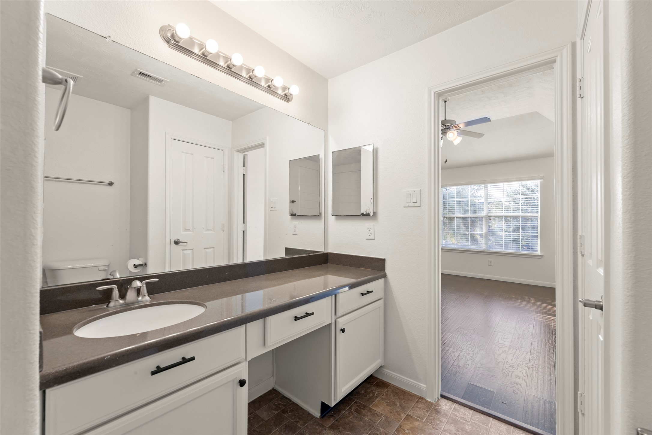 3406 Inverness Path Lane Houston, TX 77053 - Photo 29 of 34 a bathroom with a double vanity sink and a mirror