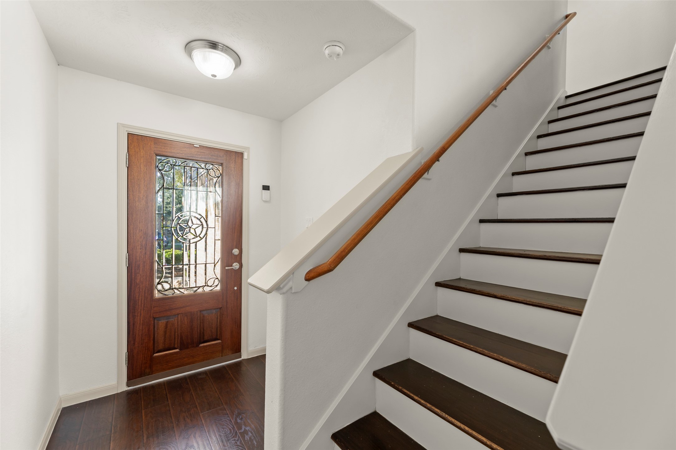 3406 Inverness Path Lane Houston, TX 77053 - Photo 5 of 34 a view of entryway with wooden floor and stairs