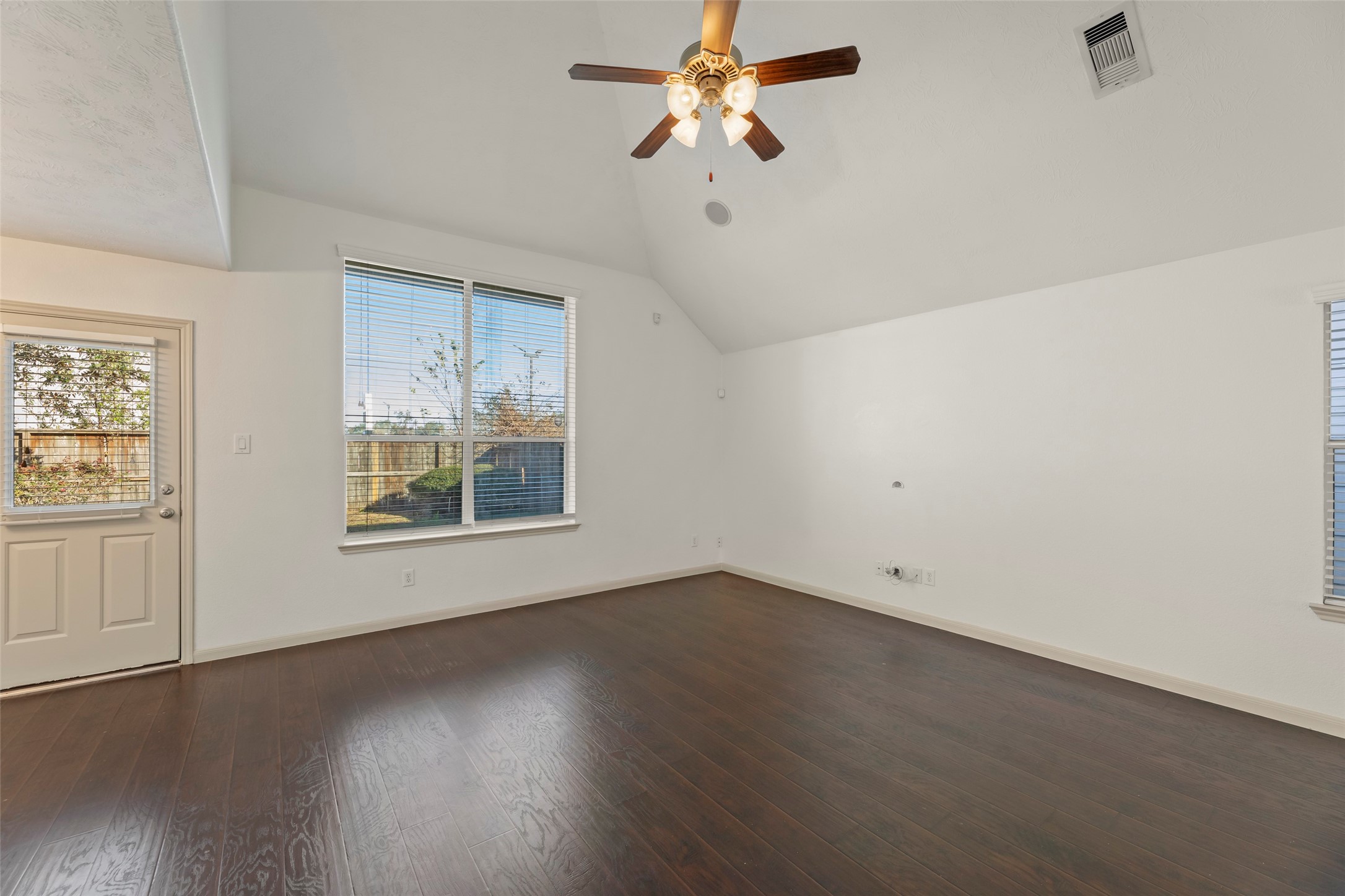 3406 Inverness Path Lane Houston, TX 77053 - Photo 9 of 34 an empty room with wooden floor fan and windows