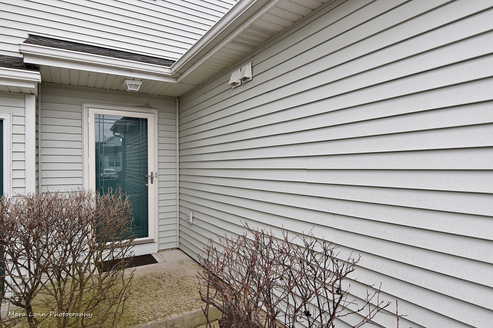 47 Rolling Oaks Road, Unit B Sugar Grove, IL 60554 - Photo 2 of 22 a view of a house with a door and wooden floor
